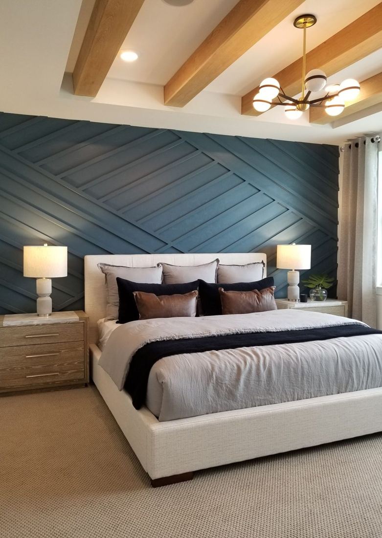 Bedroom with a navy panelled accent wall
