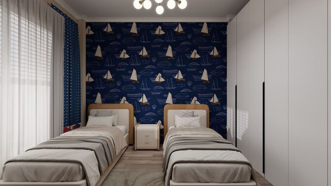 Kids room with a navy boat-print wallpaper wall